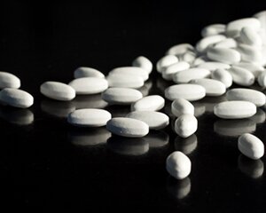 Aspirin tablets on a black background